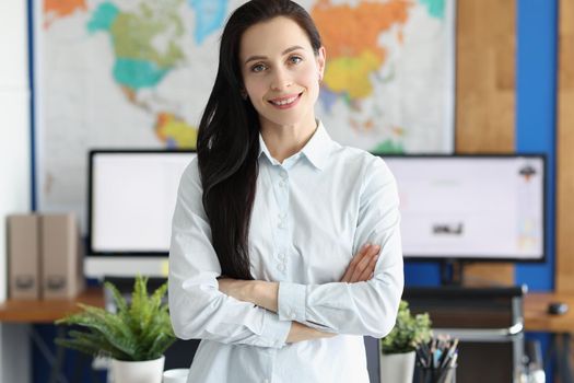 Casual business woman looks happy and smiling in office