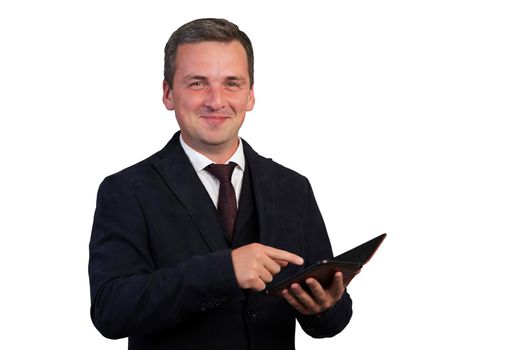 A portrait of a manly, attractive, stunning man with a gadget in his hands, looking into the camera, standing against a white background.