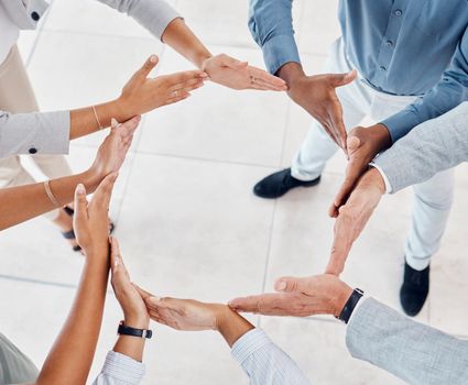 Teamwork, hands and circle in solidarity of business people in unity, collaboration and trust together at work. Diversity of a group of employee hand united for agreement, help and team for community