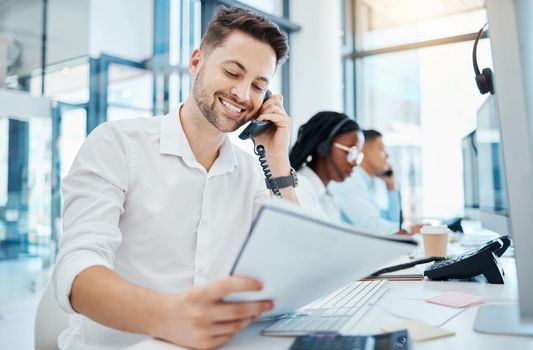 Telemarketing training and web help man on an office phone consultation with a work script. Happy internet call center and crm customer support consultant working on digital tech customer service