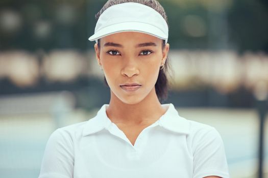Tennis, portrait and sports woman with powerful mindset, vision or goal at outdoor court practice, training or match. Young black woman professional player face with fitness mission or game outlook