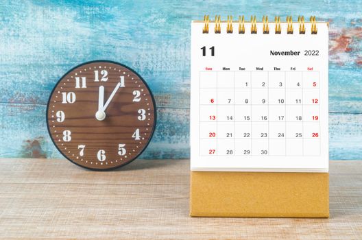 The November 2022 Monthly desk calendar for 2022 year and clock.