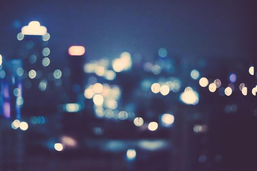 Big metropolitan city lights at night, blurry background