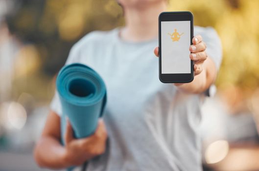 Smartphone, yoga and software mock up app, advertising or marketing with outdoor green park bokeh. Health fitness woman mat and hand with 5g cellphone mobile, download or website and mediation logo