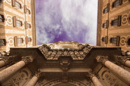 Montserrat monastery facade under a cloudy sky