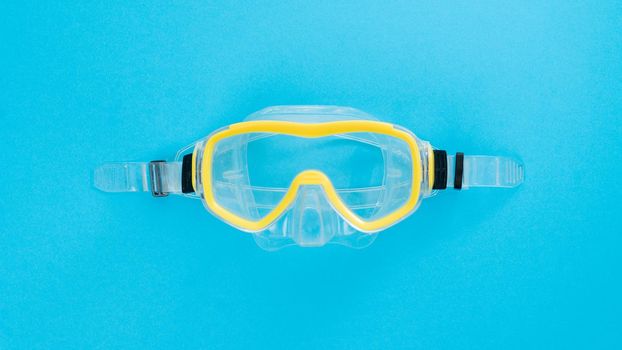 Scuba diving mask on a blue background