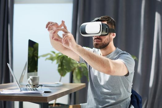 businessman in 3d glasses with virtual hologram