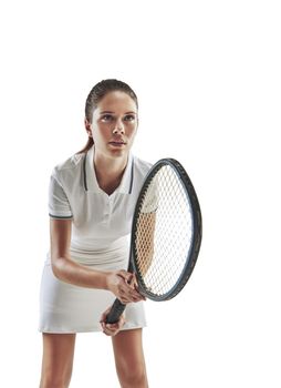 Ill let the racket do the talking. Studio shot of a female tennis player holding a racket against a white background.