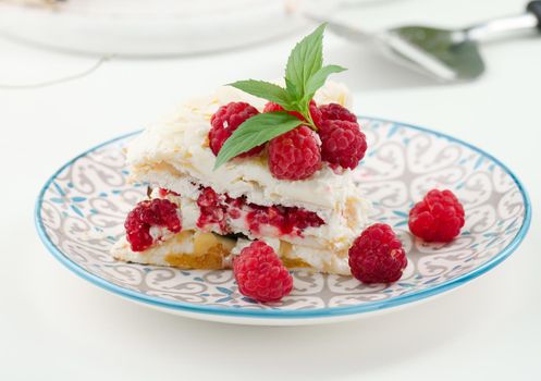 Round meringue pie with fresh raspberries on a white background, Pavlova dessert