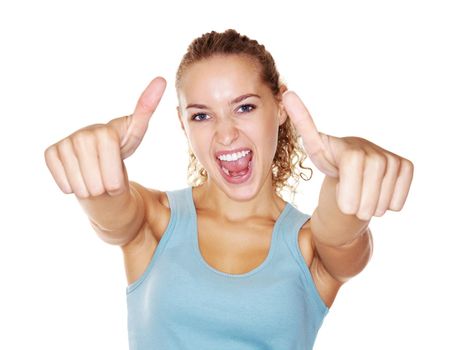 Happy young female giving you a thumbs up sign on white. Young excited female gesturing a thumbs up sign isolated against white.