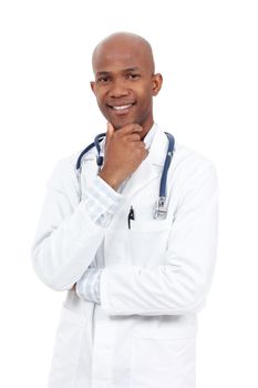 Im here to help. Studio portrait of a young and happy-looking african american doctor with his hand on his chin.