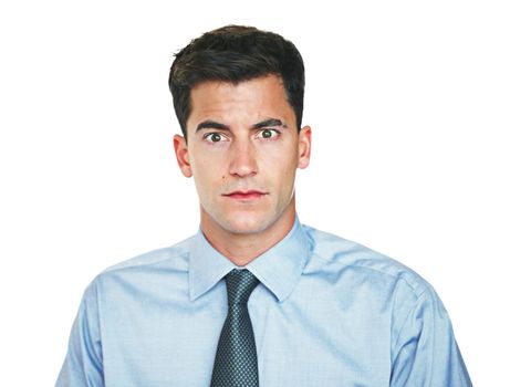 What. Studio portrait of a young businessman looking shocked against a white background.