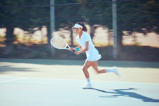 Tennis woman, serving and competitive sports during practice for match and running with racket at outdoor court. Serious, active and fitness female training for competition, leisure and wellness