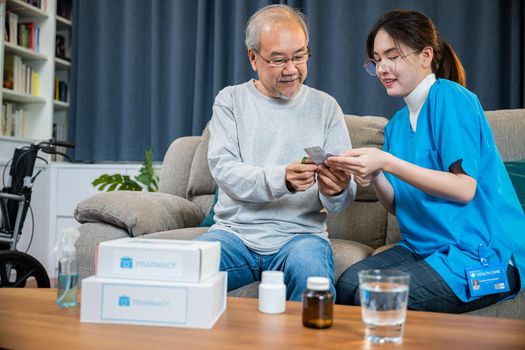 Woman nurse caregiver show prescription drug to senior man at nursing home