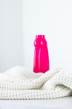 Warm knitted clothes and liquid laundry detergent