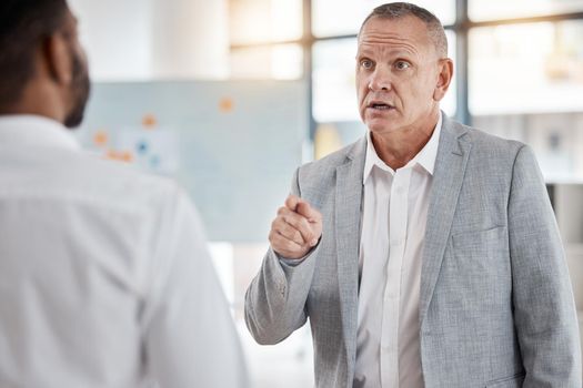 Angry businessman, finger pointing or argument or fight at workplace after misunderstanding. Leader, ceo or boss unhappy with work of employee, arguing or fighting, conflict or performance review.