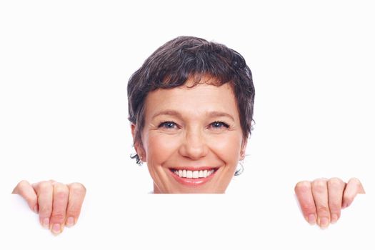 Woman displaying blank board. Closeup of smiling mature business woman displaying blank board.