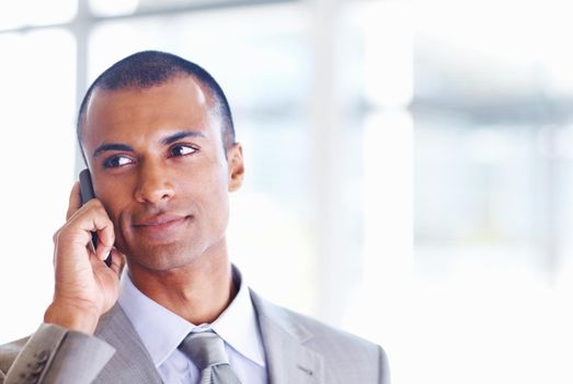 African American male executive on call. Closeup of African American business man on phone call at office.