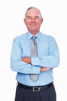Successful mature business man smiling. Portrait of smart mature business man smiling over white background with hands folded.