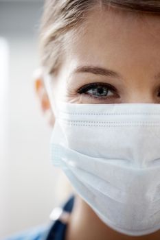 Getting ready for the operation. Cropped image of a female surgeon wearing a surgical mask.