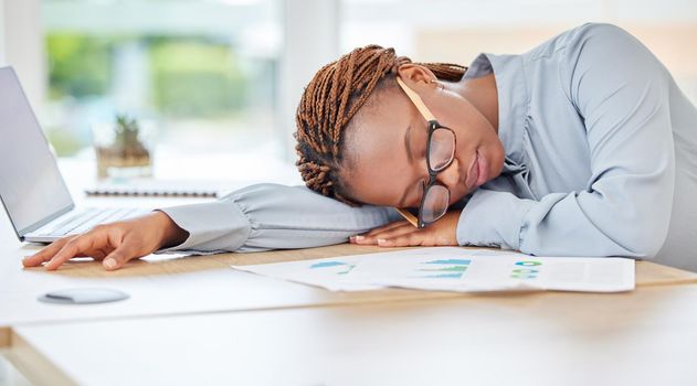Sleeping, tired or burnout black woman in finance office with desk laptop or infographic documents. Exhausted, overworked or depression for accounting compliance employee in financial audit business