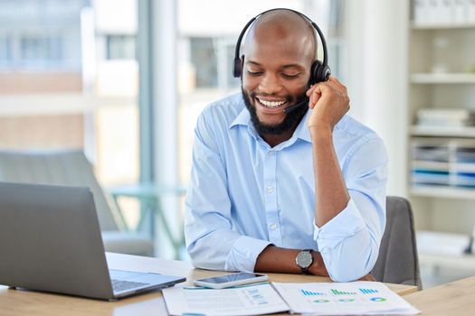 Sales man, call center agent and customer service support operator advice, help and talking communication loan in office. African, young and smile consultant, crm telemarketing and contact us working