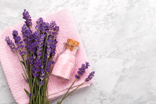 Pink towel, salt and lavender flowers 