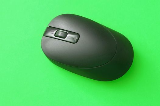Black Wireless Computer Mouse Isolated on Green