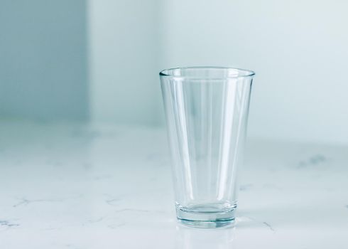 Clean empty glass on marble table