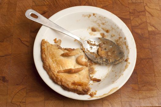 Half eaten pie with a pastry crust