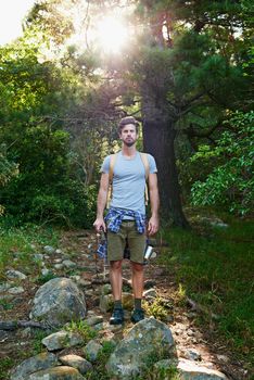 Adventure is the pursuit of life. a young outdoorsman on a hike.