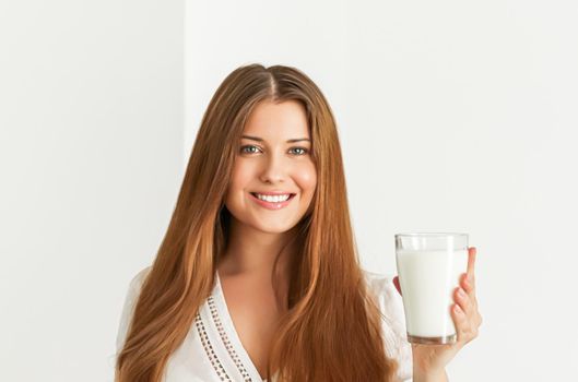 Diet, health and wellness, woman holding glass of milk or protein shake cocktail