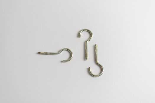 Question mark metal screws on white isolated background