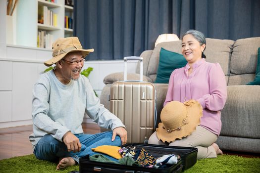 Asian couple old senior marry retired couple prepare luggage suitcase arranging for travel