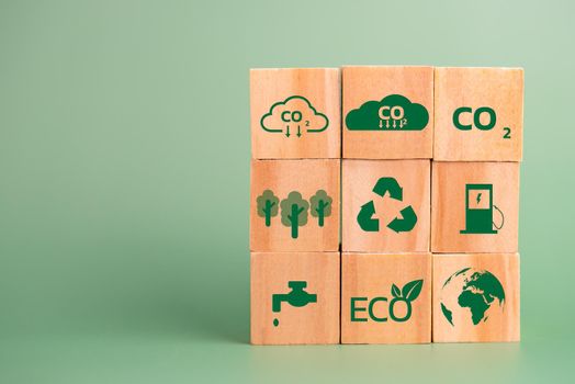 wood cube block icon co2 carbon credit and eco energy green technology on green background.