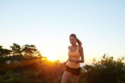 Make every run your run. a beautiful brunette training outdoors.