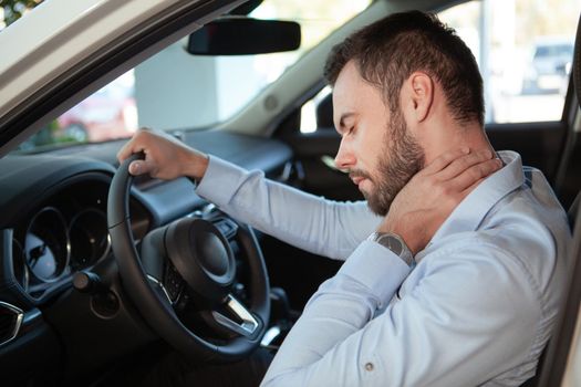 Male driver having neck and back pain