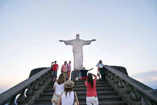 Make the pilgrimage. A group of tourists on the path to see the statue, Christ the Redeemer in Rio.