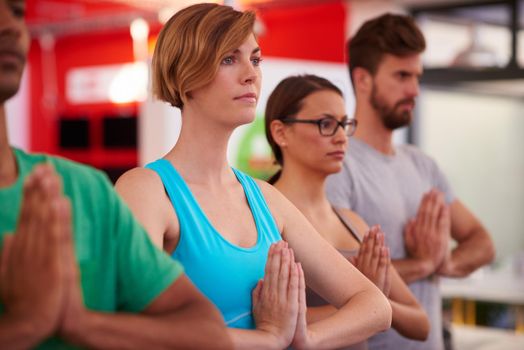 Meditation can reintroduce you to the part thats been missing. A group of people doing yoga together.