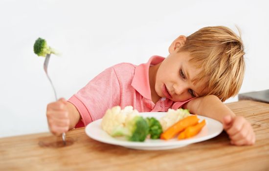 I realllly dont like veggies. A little boy very unhappy with having to eat vegetables.