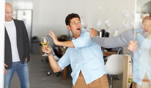 Office party gone wrong. A drunk man holding a glass of wine getting into a fight at an office social.