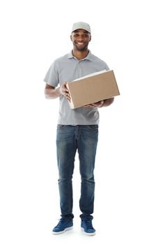 Delivering parcels with a smile. A smiling deliveryman holding a box while isolated on white.