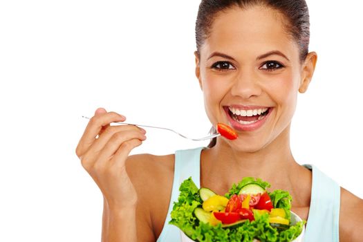 Enjoying a salad. Portrait of a beautiful young woman eating a healthy salad.