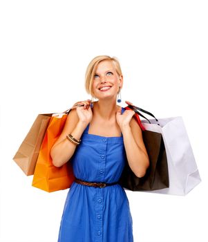 So many sales, so little time. An attractive young woman holding a bunch of shopping bags.
