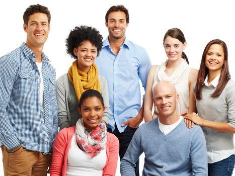 Giving happy smiles. Smiling group of casual young adults together against a white background.