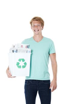 Conservation is my cause. A friendly young red-headed man holding a recycling bin filled with newspapers.