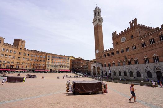 SIENA, ITALY - JUNE 22, 2022: Piazza del Campo square the main public space of the historic center of Siena, Tuscany, Italy