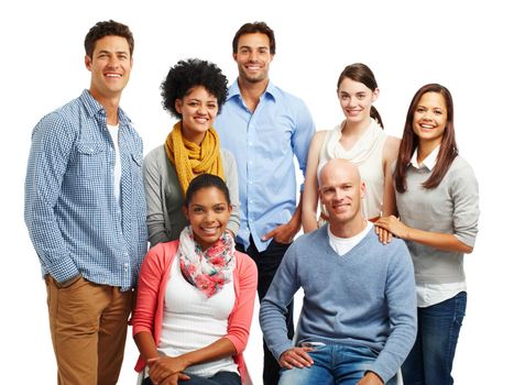 Theyre a positive bunch. Smiling group of casual young adults together against a white background.