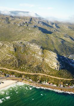 Rural transport. Aerial shot of a road and train tracks running along the western cape coastline.