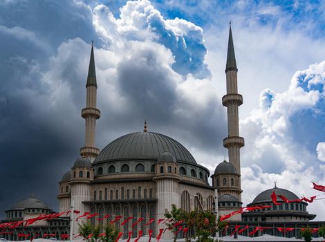 Contrast photo of the Taksim Mosque against a dramatic sky